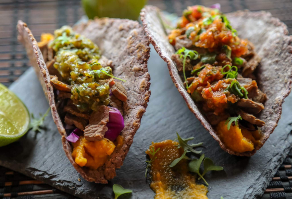 bison steak taco with garlic and butternut squash puree, salsa roja, and salsa verde